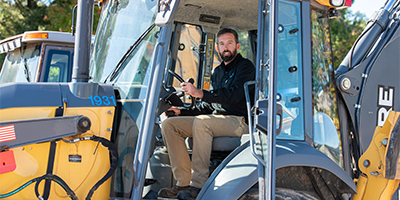 CT Water employee in a construction vehicle